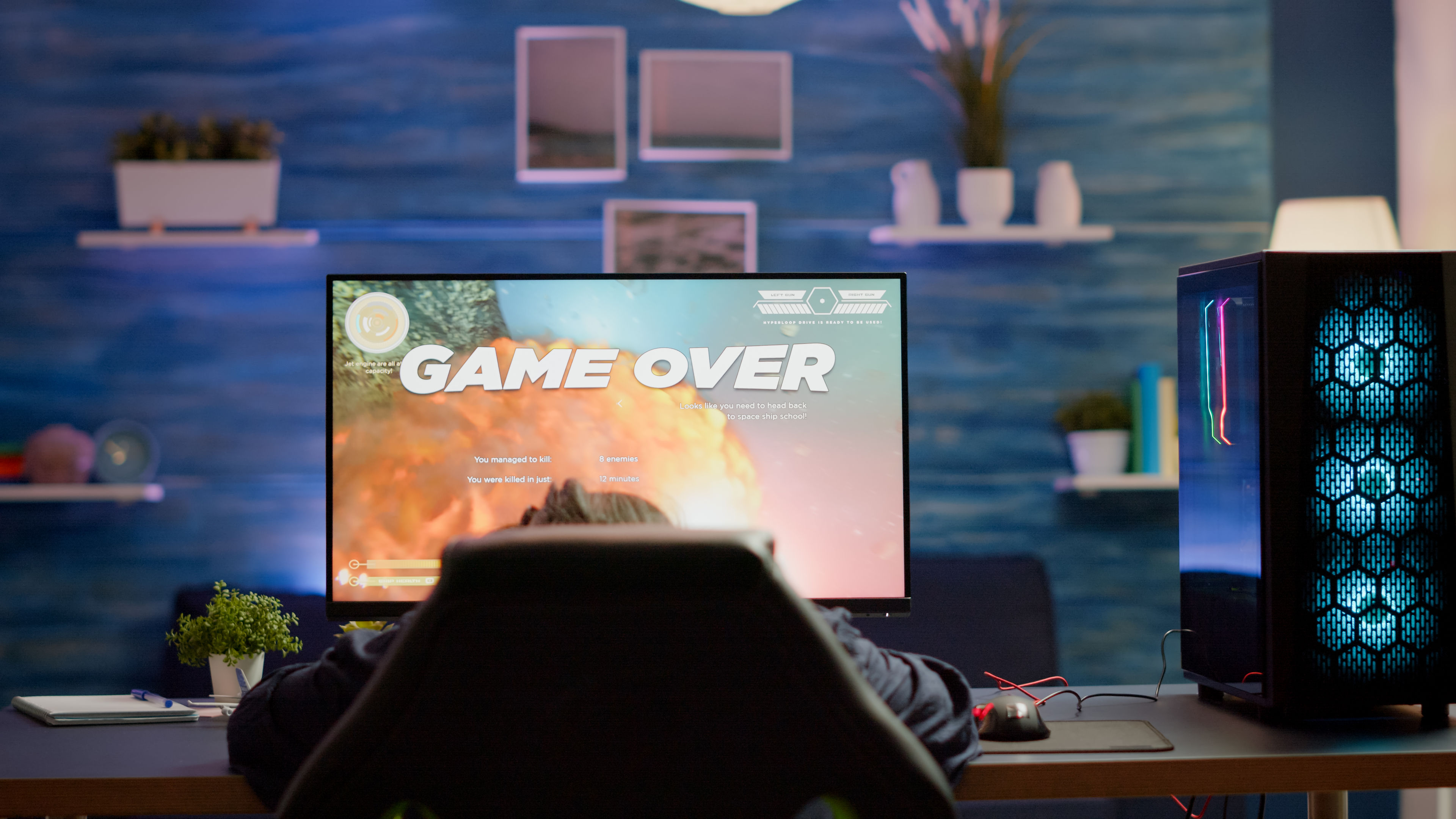 A person is slouched in their gaming chair