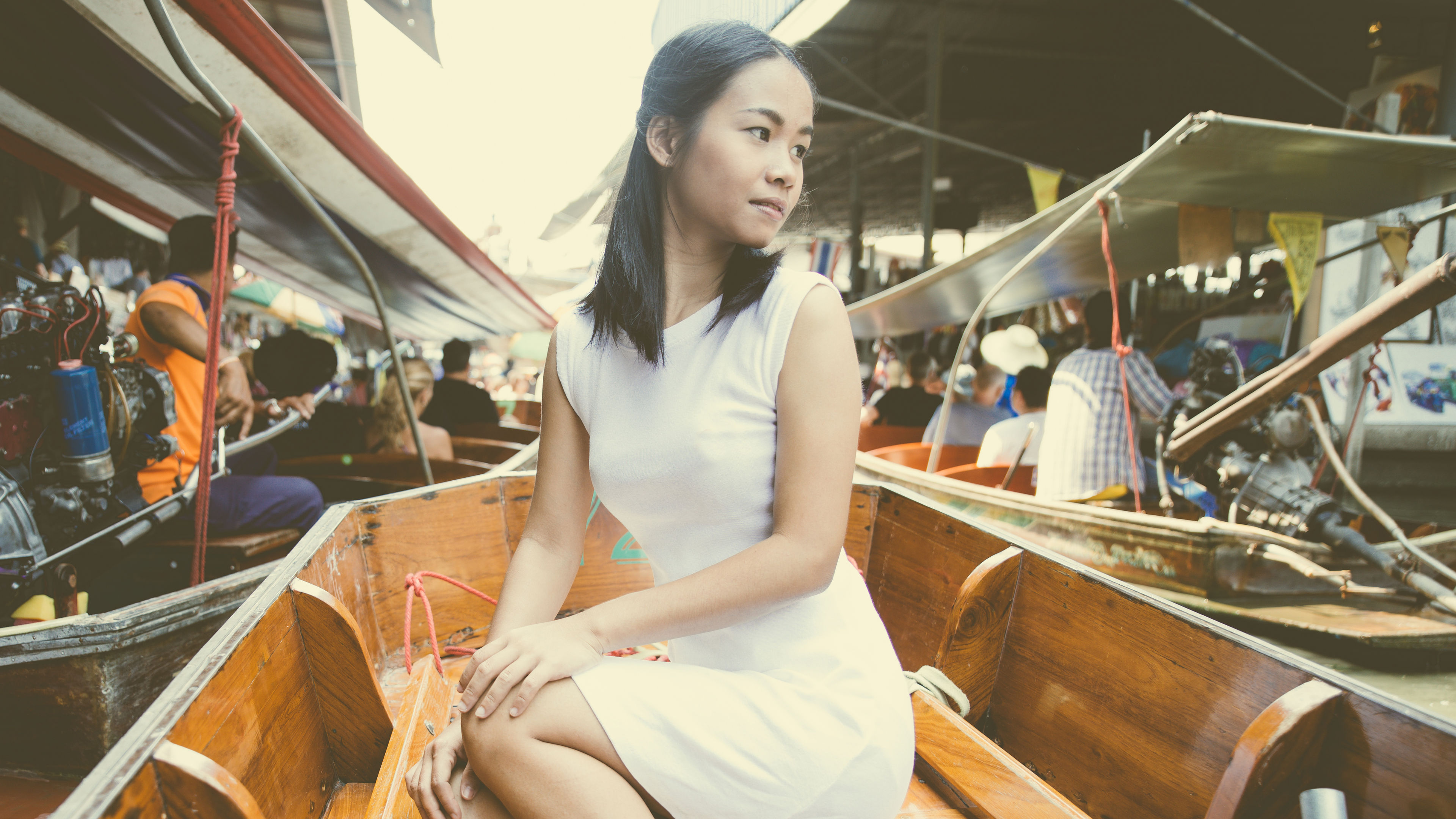 A woman in the floating market .