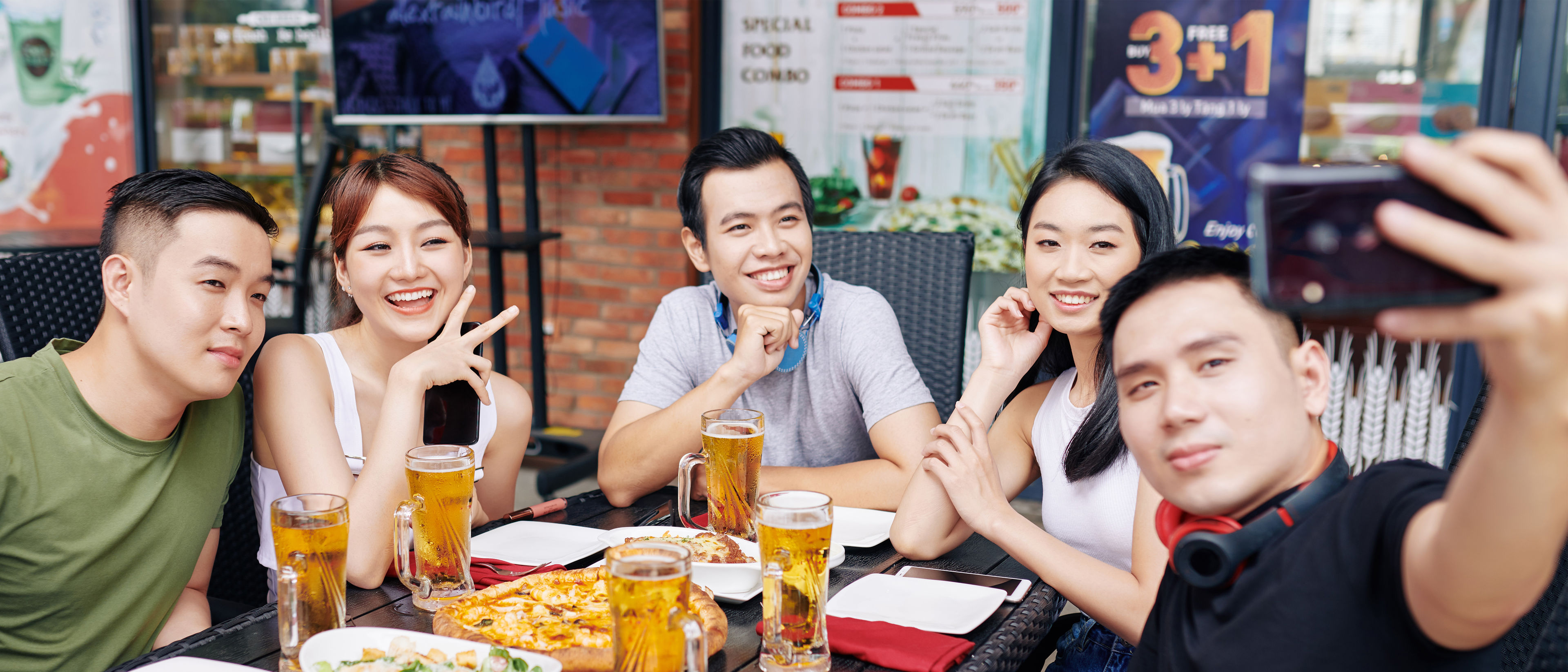 Friends taking selfie while in restaurant.